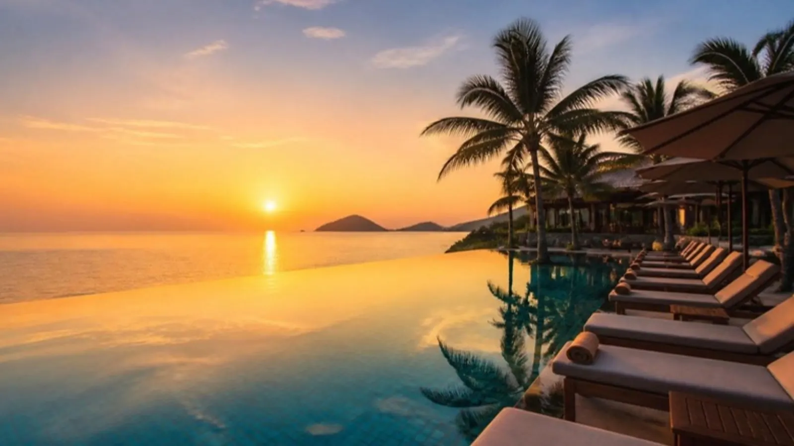 Infinity pool meeting the sea at a resort