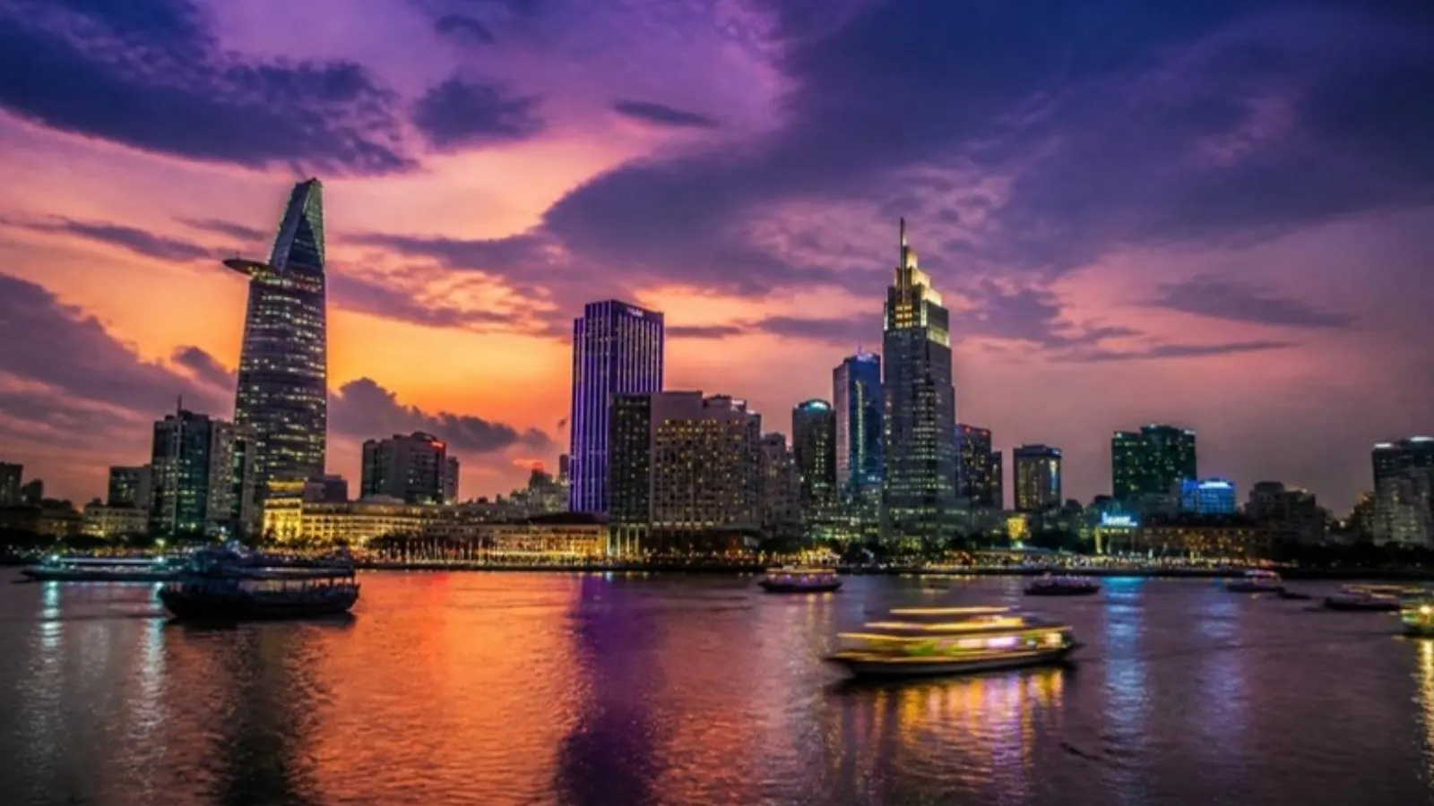 Saigon skyline and river traffic at dusk
