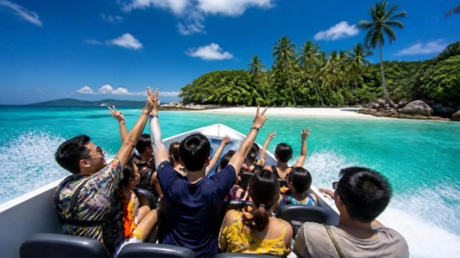 Speedboat approaching a white-sand island